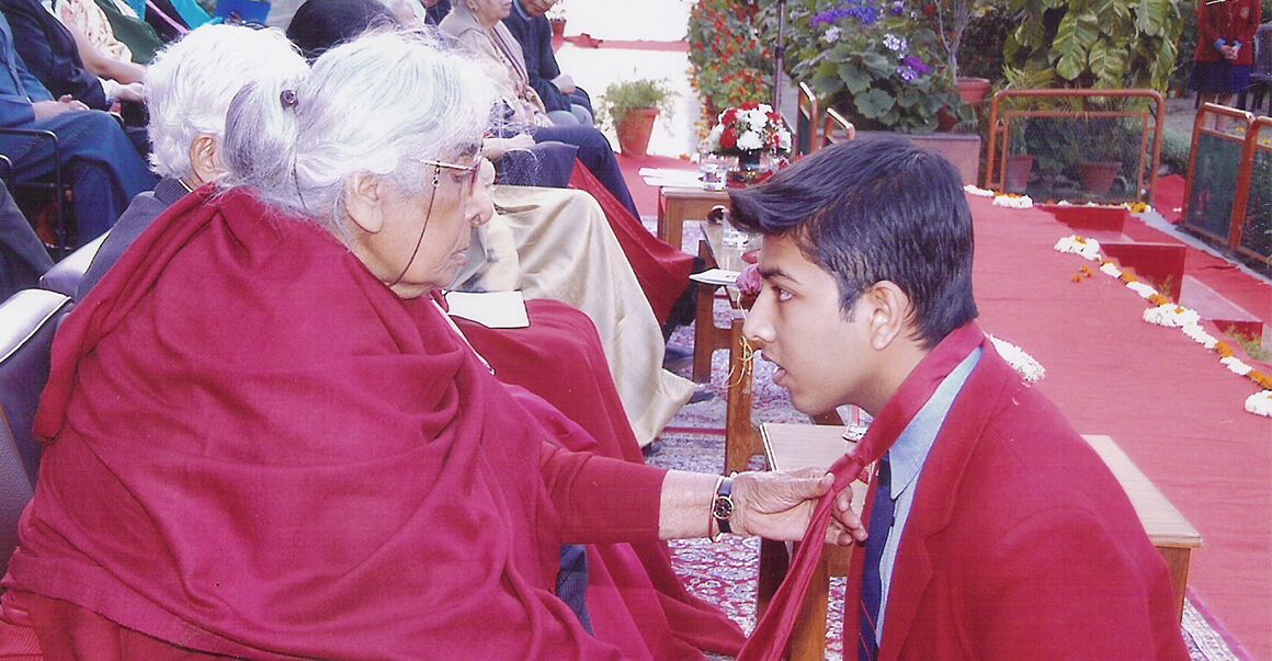 Two people in red dress image