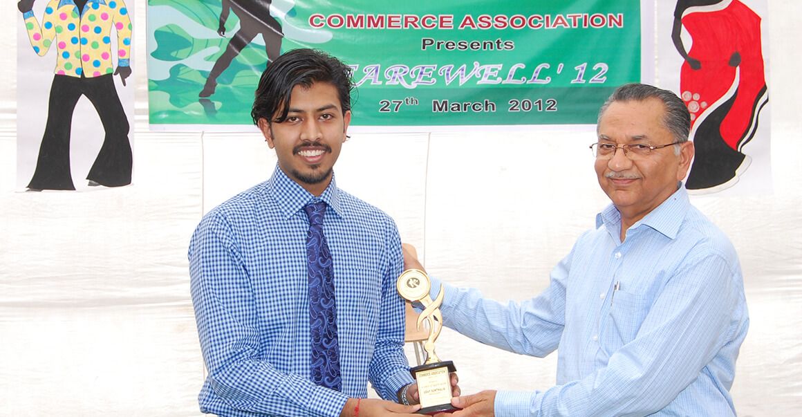 giving trophy to a student, successful indians