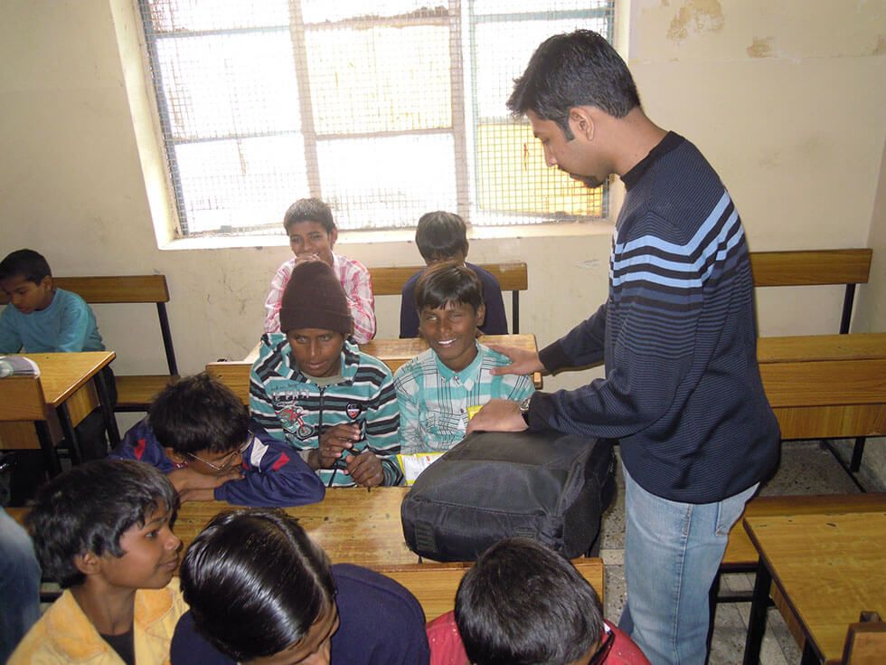 man distributing gifts to children image