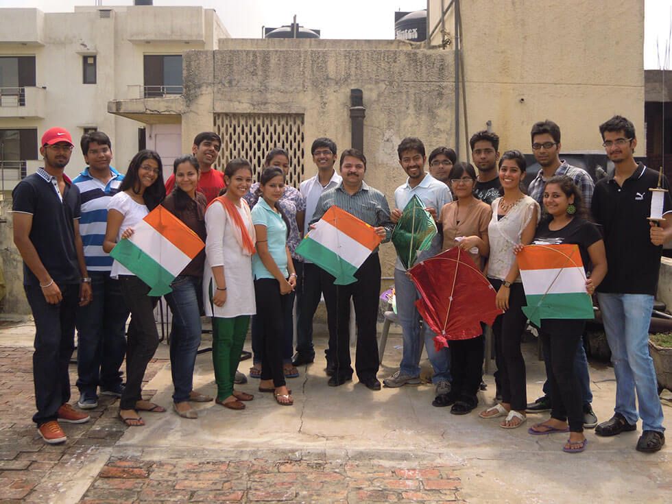 people holding kites in hands, Indian Entreprenuer Philanthropic